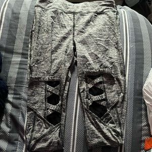 grey leggings with cool cross design by ankles